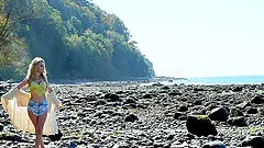 Model hits the beach for some sexy nude sunbathing