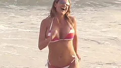 Provocative babes seduced on the beach and shagged in a threesome