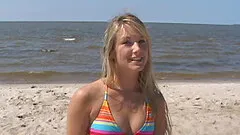 Bikini teen strips on the beach and hula hoops in the nude