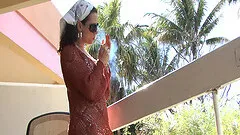 Sexy lady smokes and show off her pussy in balcony