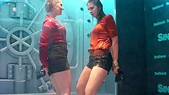Fully clothed ladies dancing under the shower in a club