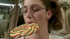 Sleazy bitch in glasses has her face covered in cum by a group of men