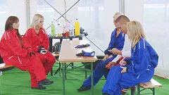 Racing babes get naked and have a hot orgy in the tent