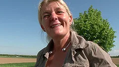 Old chick in the trunk of a car fucks her hot vagina