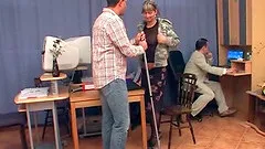 Cleaning lady with glasses plays with three co-workers' cocks