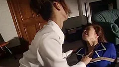 dominate Japanese woman pours hot wax on her slave girl's back