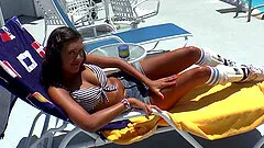 She starts with sunbathing and ends with a hot facial