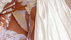 Breathtaking bride dressed in white strips and teases her tits