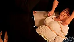 Horny Japanese broad has her hot pussy rubbed with toys in a kinky bondage fetish action