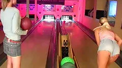 Wild teen sluts at a bowling alley toy their fuck holes