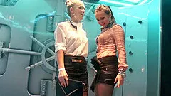 Sexy girls dance wet at a raining arena earning them a provoking look