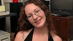 On her knees this amateur wears her glasses while giving head