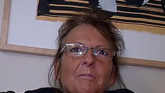 Kinky granny with glasses playing with her shaved pussy