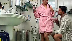 Skinny wife with small titties gives head in the bathroom