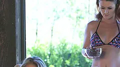 Lingerie clad lesbian couple go down on each other on the couch