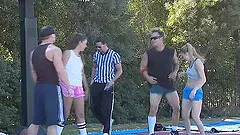 Gangbanging two delicious bombshells on a tennis court