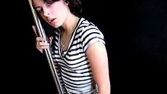 Spreading her sexy long legs around the stripping pole