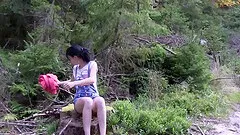She strips off her shorts on a nature walk and fingers her cunt