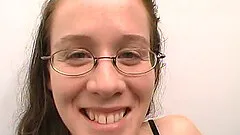 Brunette with glasses licking and sucking her boyfriend's big cock