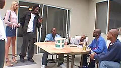 Mini-skirt clad blonde with petite gorgeous tits enjoying an interracial gangbang