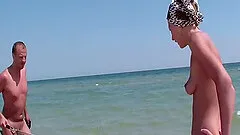 A couple gets naked at the beach and fucks in the sand