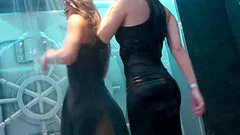Dancing sluts having a shower together on the stage in a club