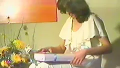 Retro video of a woman wearing nylons while using her vibrator