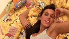 A skinny hottie plows her pussy with a toy while rubbing her clit