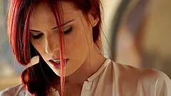 A drop dead gorgeous redhead loves rubbing her tender clit