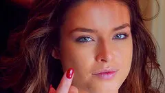 Seductive brunette beauty in a glamorous stripping