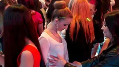 A male stripper pulls a chick on stage and fucks her mouth