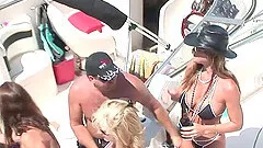 Attractive babes in shorts and sexy bikinis partying in a yacht outdoor in reality shoot