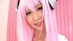 A pink haired Japanese babe in a bikini gets jizzed on