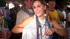 Sexy blonde milf wearing glasses shows her tits at a party