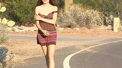 Lola strips naked and walks down a public street wearing only a smile