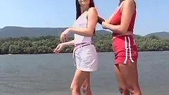 Lesbian girlfriend have naked fun in the sun at the beach