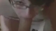 Amateur brunette wearing glasses gets face-fucked in homemade clip