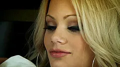 Seductive blonde with big fake tits gets a cumshot after getting her shaved pussy fucked hardcore