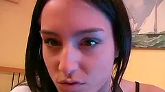 Charming solo model brunette with small tits unpinning her thong before fingering her pussy on a webcam