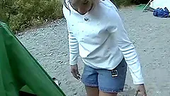 On the bank of a river this couple strips down and fucks hard