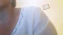 Short-haired milf, wearing thong, shows her butt in homemade clip