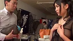 A Japanese girl is gangbanged in the back room of an office
