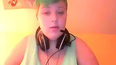 Green-haired amateur bitch shows her enormous tits for the webcam