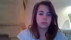 Busty brunette slut plays with her tits in front of a webcam
