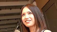 A cute Japanese girl uses her mouth and hand to satisfy a man