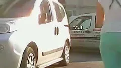 Dark-haired chick walking down the street gets caught on a voyeur's cam