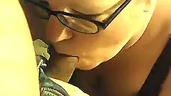 Nerdy woman wearing glasses enjoys sucking a cock in homemade clip
