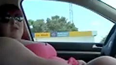 Obese skank wearing glasses rubs her twat in a car