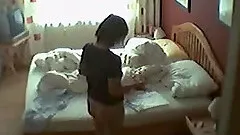 Amateur brunette toys her pussy in front of a hidden cam