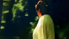 Obese brunette strips in a forest in homemade video